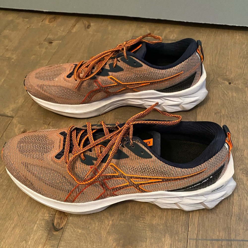 ASIC Novablast 2 sneakers. Size 11.5 Mens. Good condition. Orange color.